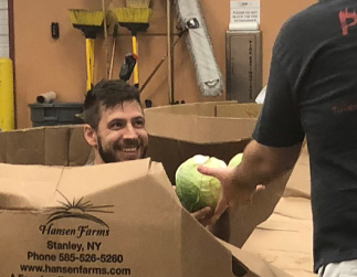 Cabbage Jared Jared Warren, ServiceCentral's digital marketing manager, having fun volunteering at the Community Food Bank of Eastern Oklahoma